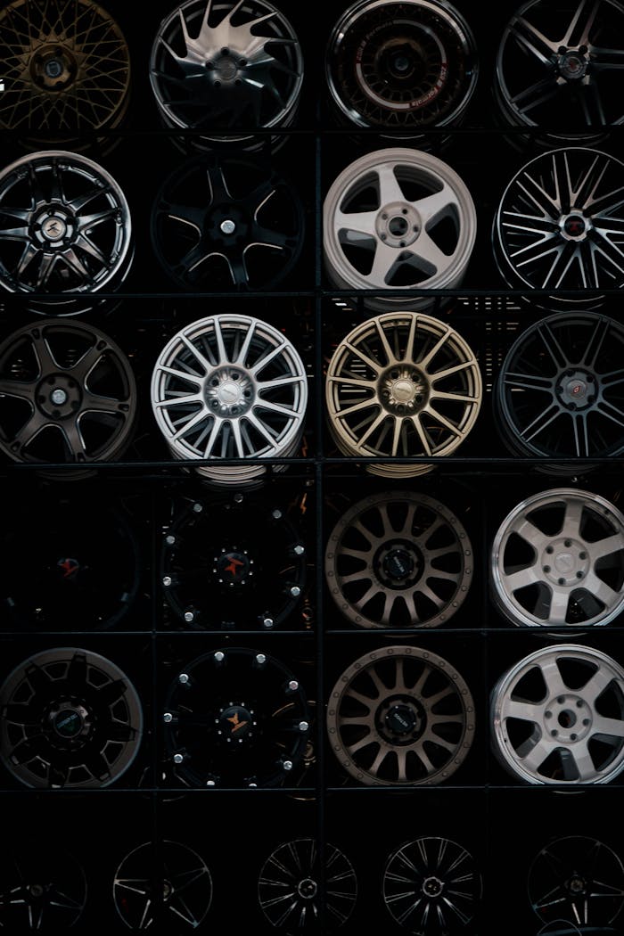 team-01 A variety of alloy wheels on display, showcasing different styles and finishes.